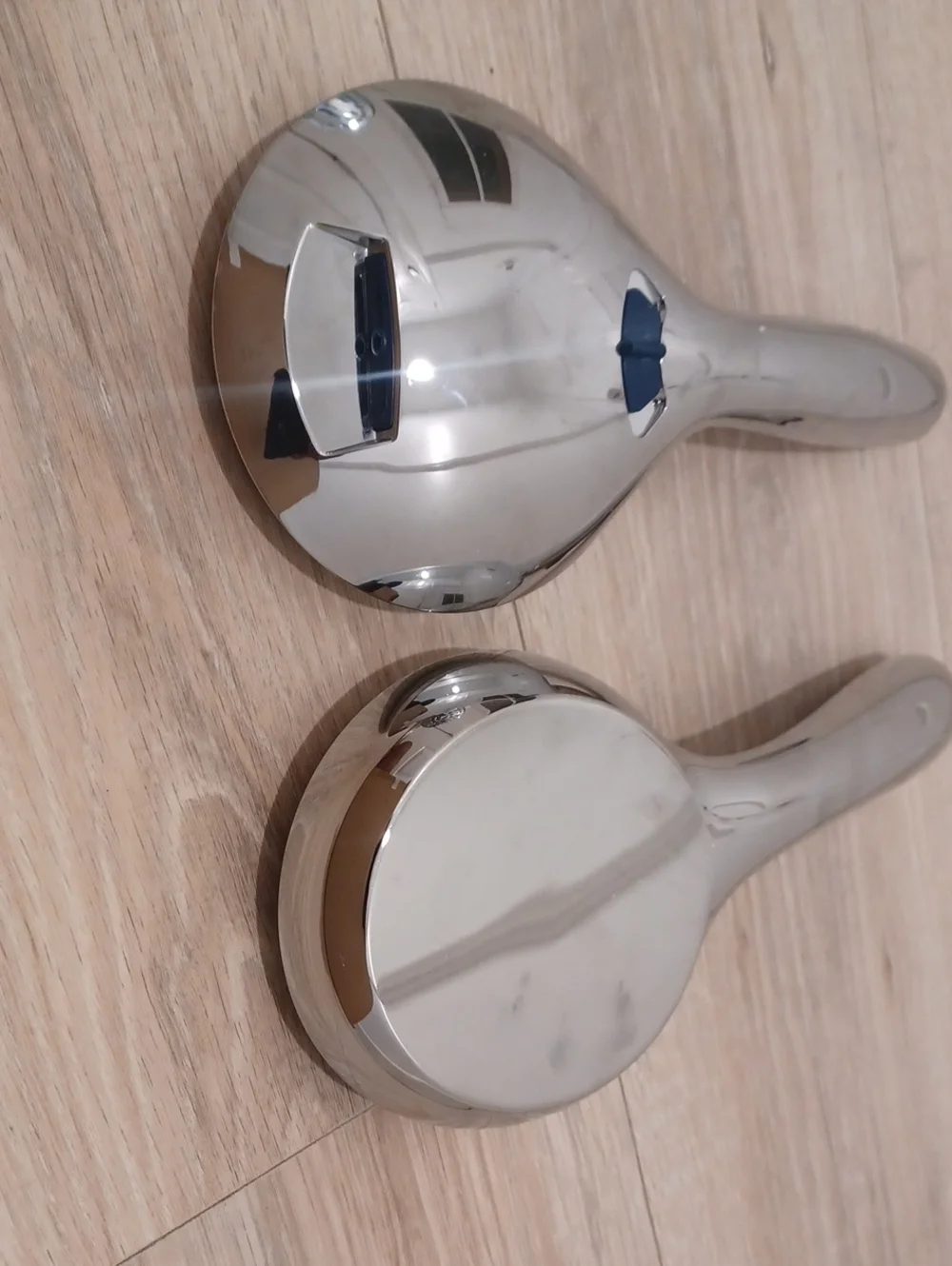 Bundle of chrome shower heads with flexible hose. Bath. Hand held.